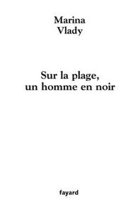 SUR LA PLAGE, UN HOMME EN NOIR
