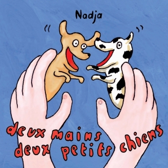 Picture of deux mains deux petits chiens