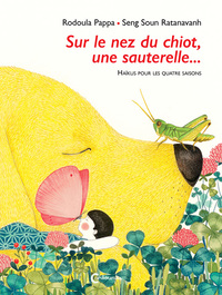 Image de Sur le nez du chiot, une sauterelle